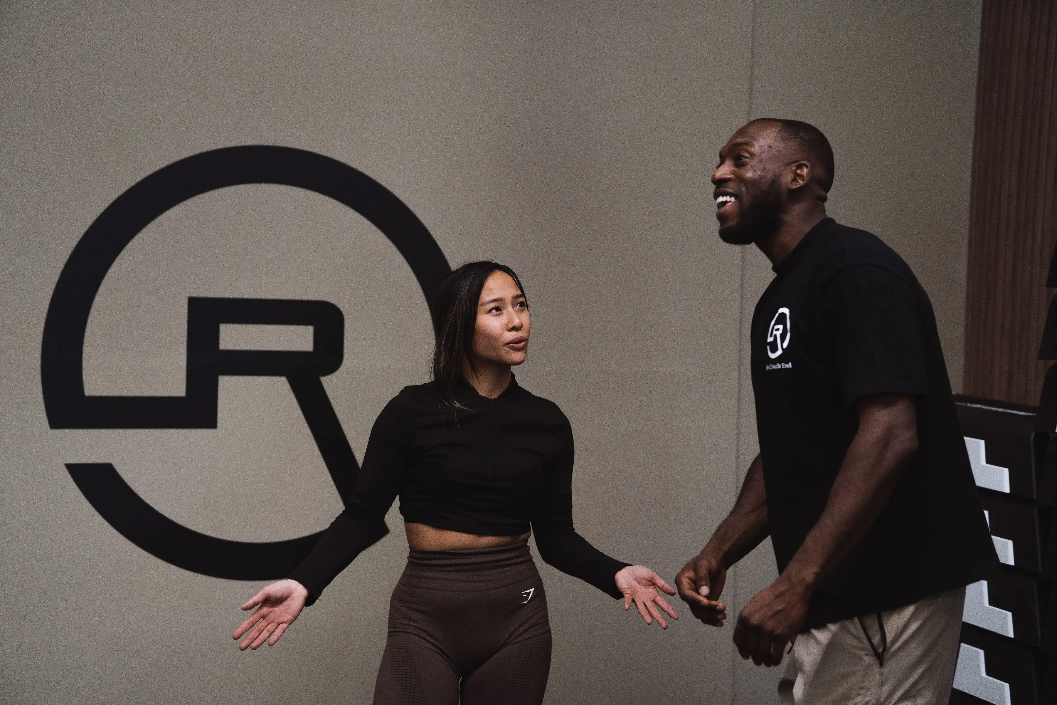 Rise Fitness Studio interior with logo and equipment
