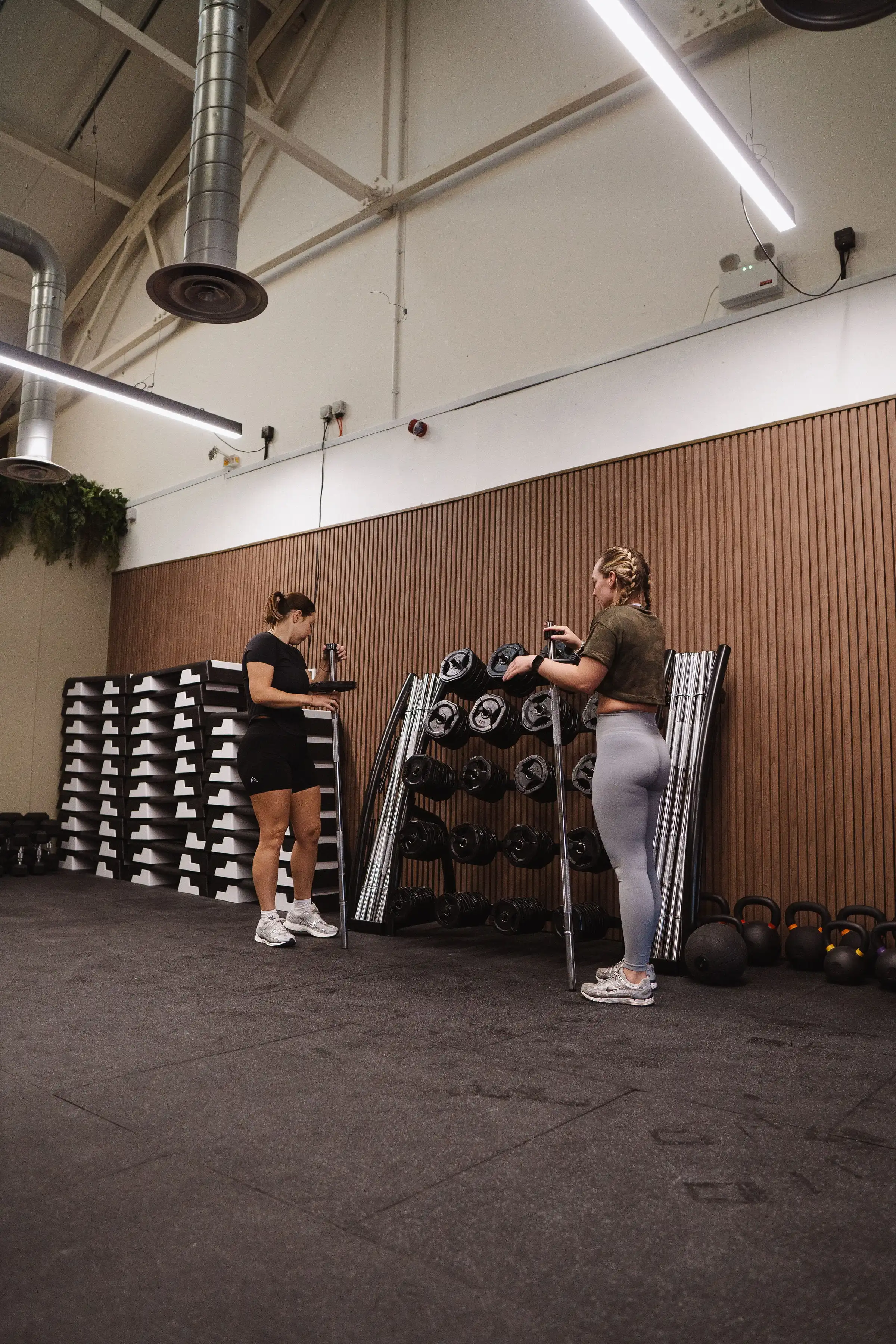 Rise Fitness Studio interior with members training